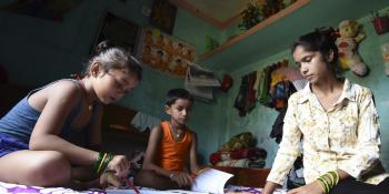 Little Sister Anjali Patel helping her nephews study at her home during the Covid 19 pandemic lockdown in Nepal