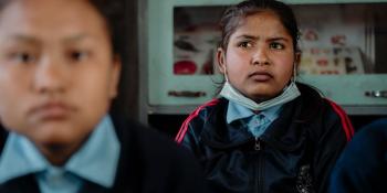 Inza, age 12, in the classroom