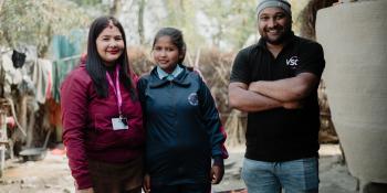 Inza, pictured with VSO volunteers Nitin and Deepa.