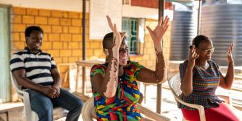 Health care workers learning Kenya Sign language 