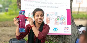 Youth Health Champion Manisha gives a demonstration on sanitary pads