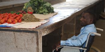 Nkonge selling fruit at his stall