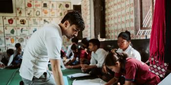 Volunteer Raj in a school classroom.