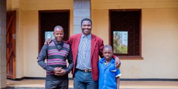 VSO volunteer Theonas, with teacher Peter and student Thoko