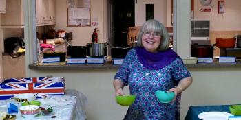 Guildford supporter groups member Anita cooks up a storm at their curry fundraiser