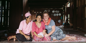 VSO volunteer Ans Ohms, midwife in Cambodia, with local colleague and mother