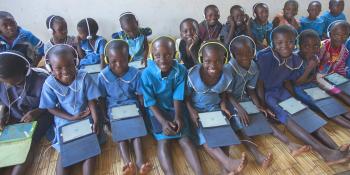 Children in Malawi using VSO Unlocking Talent tablet technology in a oneclass learning centre Children using tablet computers in a Malawi classroom | VSO