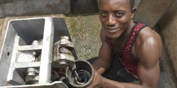 Foday Lansana fixing a water pump Foday Lansana, local mechanic in Nengbema village, Sierra Leone fixing a water pump