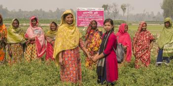 VSO Bangladesh volunteer Nowrin is pictured with the member of an all-women farming collective at Bhelarpara, Birampur, in Dinajpurpur, northern Bangladesh
