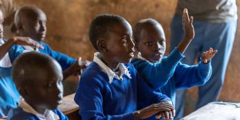 Students Learning Kenya sign language from VSO volunteers