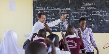 Volunteer Paul teaching a class with teacher-mentor Rebecca