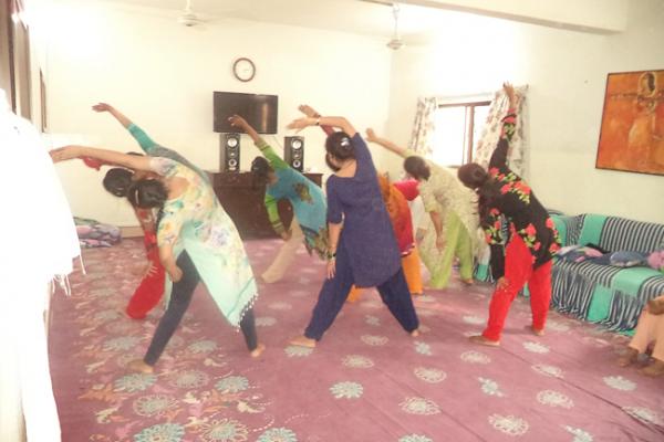 Women at Panah shelter practicing yoga