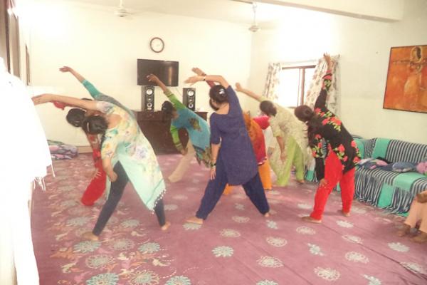 Women at Panah shelter practicing yoga Women at Panah shelter practicing yoga