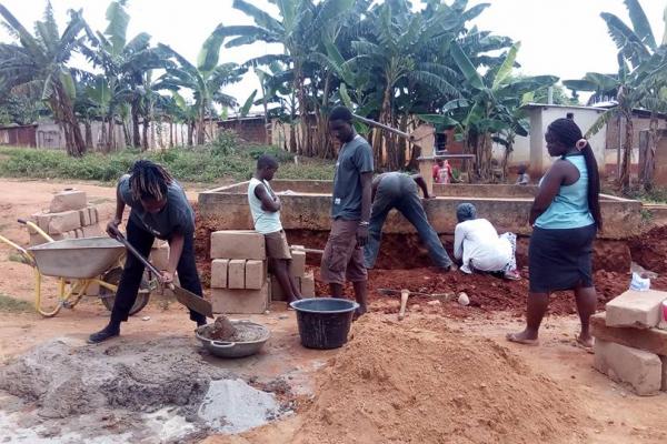 ICS volunteers construct a well in Ghana