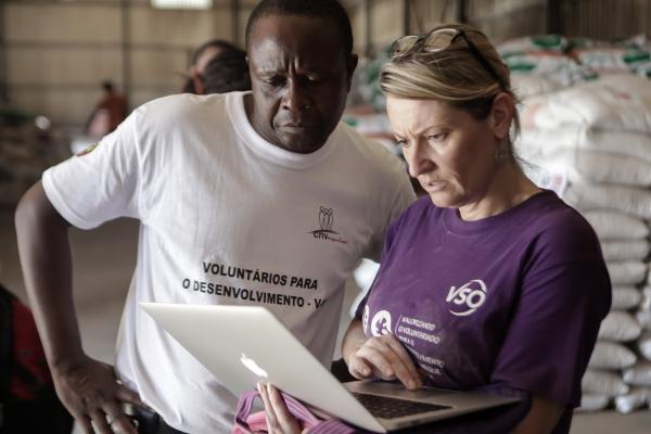 VSO Mozambique Country Director, Ria, and Resilience Advisor, Jonah Tendere, at the INGC warehouse in Gondola, Manica Province.