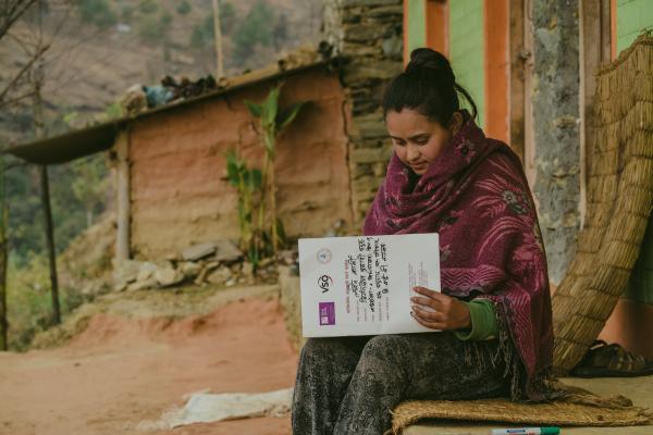 Laxmi Karki filling the record book as part of VSO research into gender based violence in Nepal