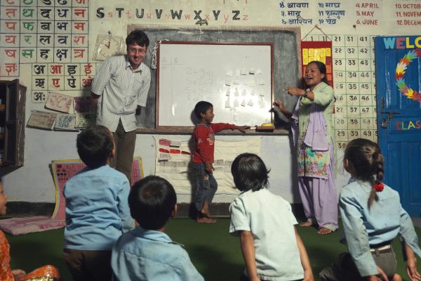 VSO Volunteer Gareth at Bal Mandir School. Gareth has been responsible for bringing interactive learning to local schools. It has been a great success with attendances and results continuing to improve.