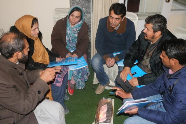 One of the community consultations in action, where participants are learning about and discussing the SDGs.