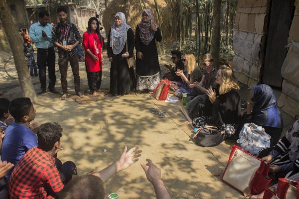 Volunteer in Bangladesh. VSO ICS volunteers in Birampur, northern Bangladesh join a youth meeting. The volunteers work with the local youth club to deliver sessions on governance and sexual and reproductive health rights