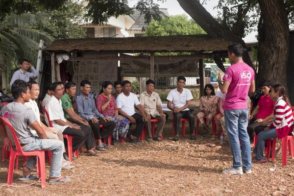 Volunteer in Cambodia. National volunteer Mongkol Lyn runs a training workshop with farmers about the Sustainable Rice Platform (SRP). SRP works to ensure rice is grown sustainably, profitably and to a high quality.