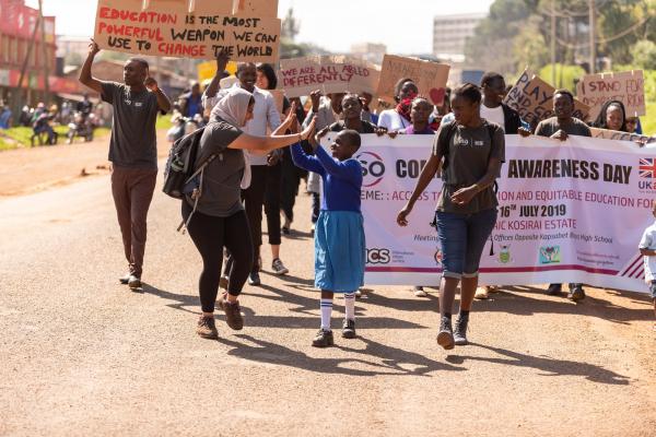 Volunteer in Kenya, Raabia Hussain, during the deafway project community awareness parade in Nandi town, Kenya.