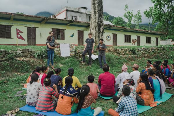 Volunteer in Nepal. ICS youth volunteers at a community action day. 