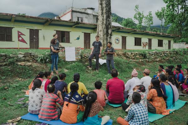 Volunteer in Nepal. ICS youth volunteers at a community action day.