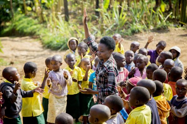 Teacher Josephine takes the register at school in Rwanda