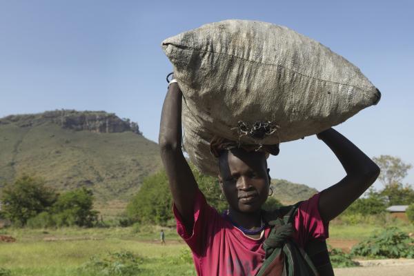 Girl selling charcoal, Karamoja Uganda