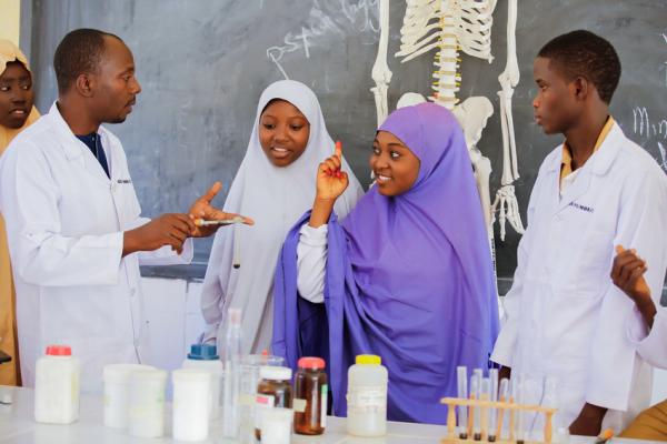 Students working on a science experiment in Nigeria