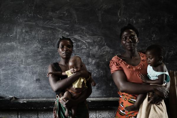 Two mothers who have lost their partners in the flood