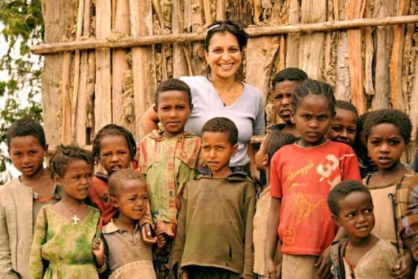 Former volunteer Julia Lalla-Maharajh with children in Ethiopia