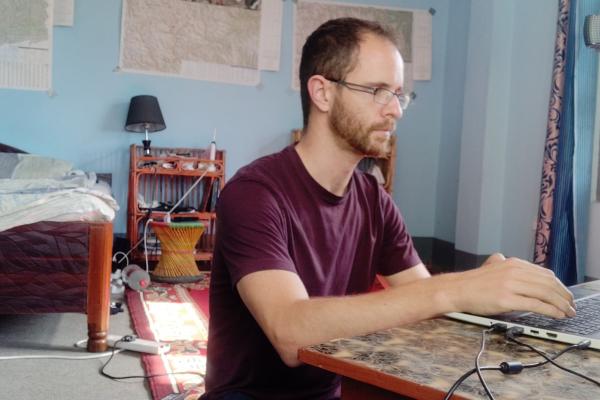 James Russell works at his laptop from his placement accommodation in Surkhet, Nepal.
