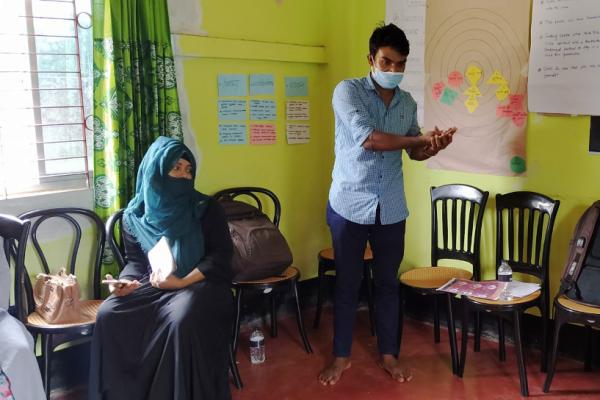 a man delivering a training session in a classroom