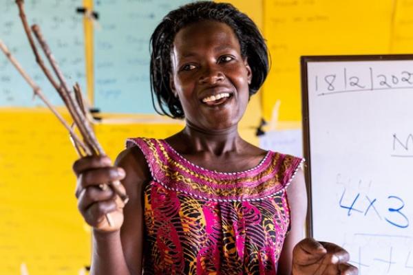 Christine teaching with counting sticks at the catch up centre