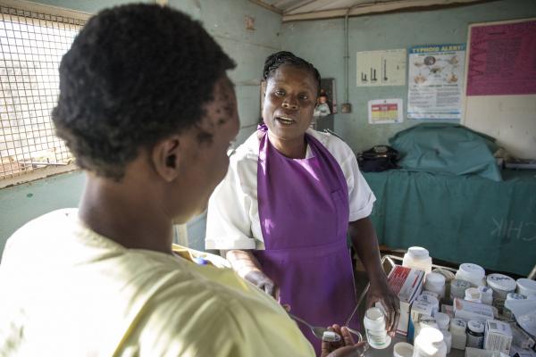 A nurse gives an inmate her antiretroviral medication at Chikurubi Female Prison.