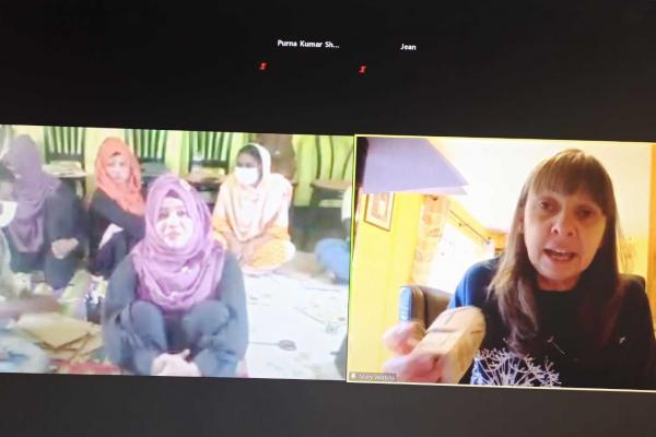 Mary Watkins, VSO volunteer talks to mothers and big sisters In Cox's Bazar Refugee Settlement over zoom video conference