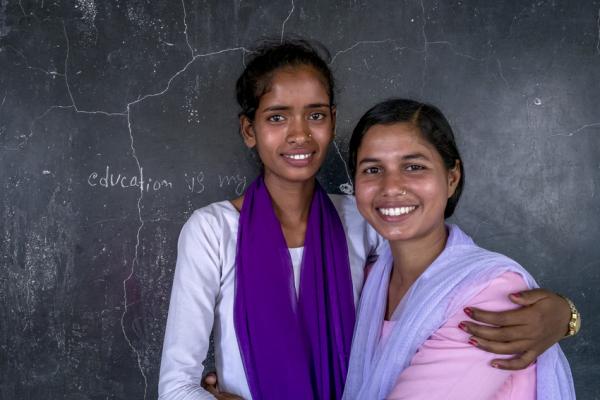 15-year-old "Little Sister" Arti and her "Big Sister," 20-years-old Anu,