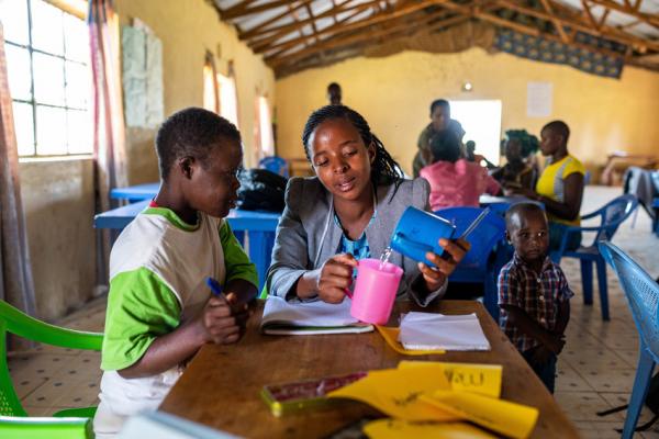 Teacher and student at a catch-up centre. Migori. Kenya.