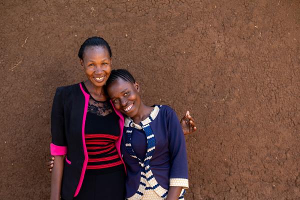 Evalyne (17 years old) with her mentor Gati Rioba Mwita (38 years old) together at the Siabai catch-up centre, Migori, southwest Kenya. Gati supports Evalyne through any challenges she is facing and with her studies at the centre.