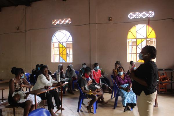 Community Development Officer talking to community. Jinja district.