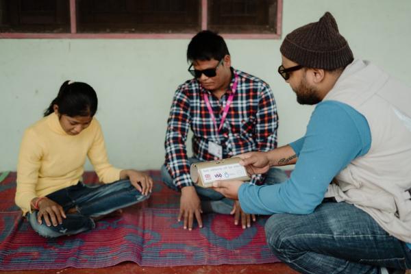 Volunteers using tablets