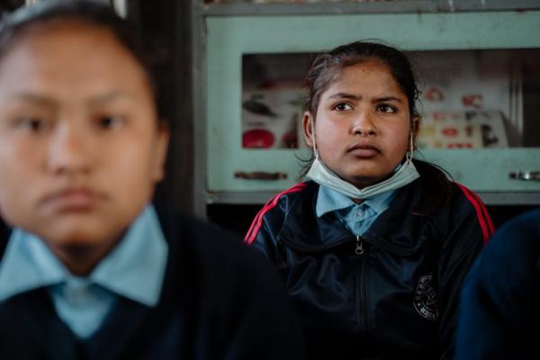 Inza, age 12, in the classroom