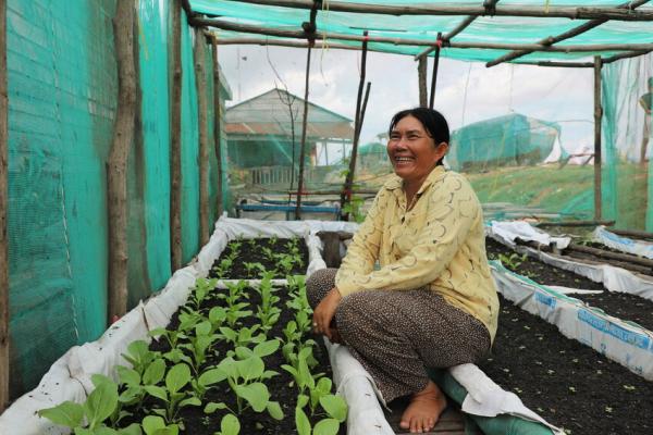 Chum Srey Nga (50) now uses her floating vegetable garden for income rather than fishing