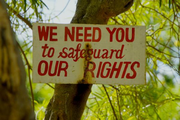 Sign reads: We need you to safeguard our rights