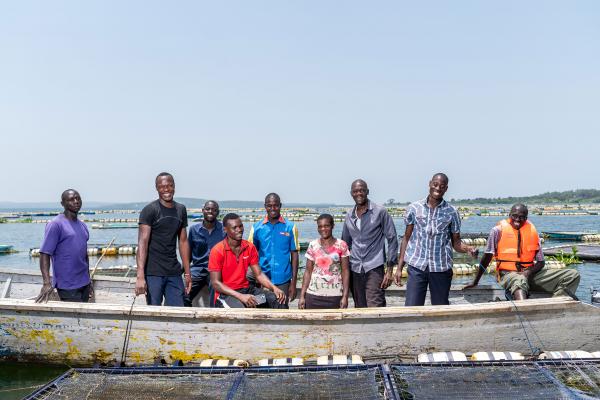 Alego Young turks members after feeding fish in their cages. Lake Zone. Tanzania