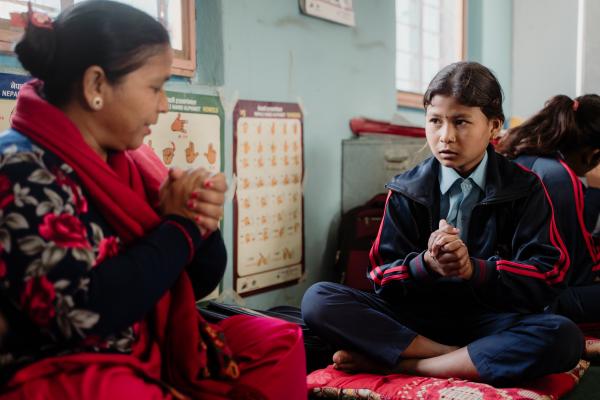 Nina working with her sign language interpreter