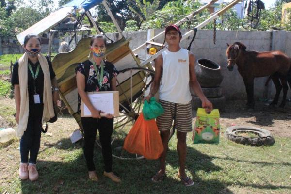 Volunteers hand out emergency supplies in the Philippines