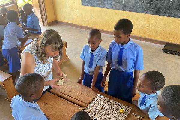 Mary helping children with their maths