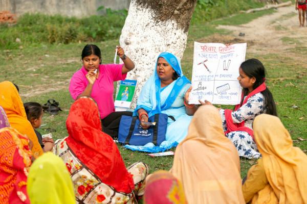 National volunteers in Nepal explaining about Depo-Provera shots to local women in Gaur municipality.